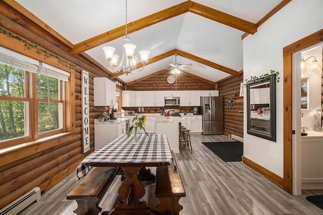 10780 S 29th Rd, Cadillac, MI 49601 - dining area with log walls, baseboard heating, wood finished floors, ceiling fan, and a chandelier