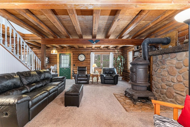 10780 S 29th Rd, Cadillac, MI 49601 - living area featuring rustic walls, a wood stove, carpet, wooden ceiling, and beam ceiling