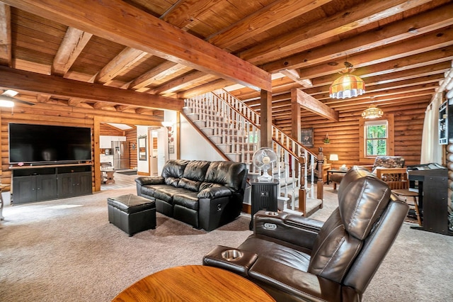 10780 S 29th Rd, Cadillac, MI 49601 - carpeted living room with rustic walls, stairs, beamed ceiling, and wood ceiling