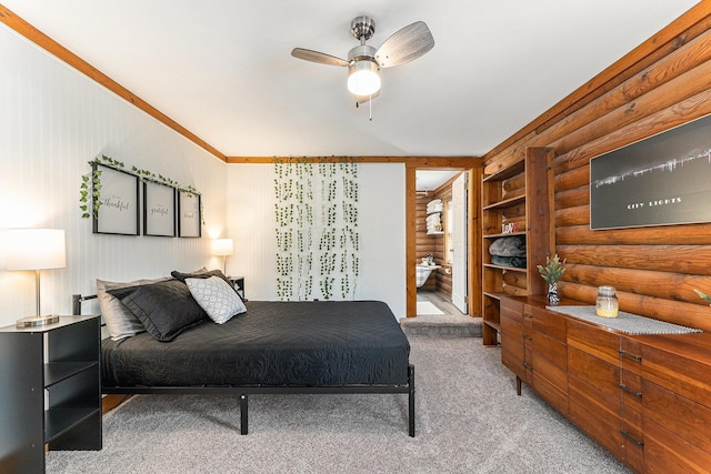 10780 S 29th Rd, Cadillac, MI 49601 - carpeted bedroom with log walls, ensuite bath, and a ceiling fan