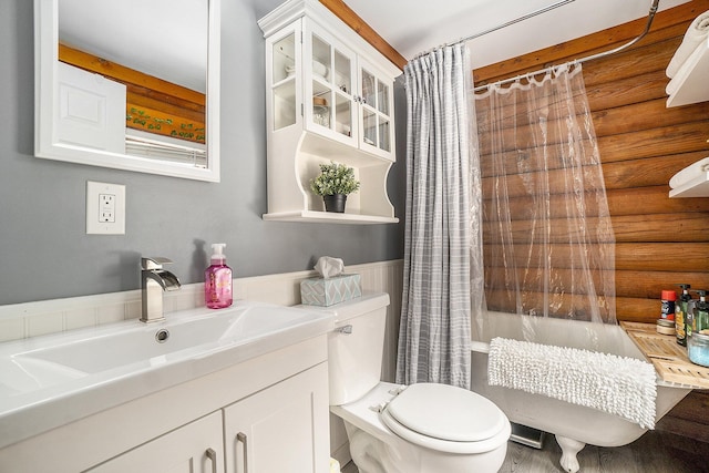 10780 S 29th Rd, Cadillac, MI 49601 - bathroom with rustic walls, toilet, vanity, wood finished floors, and wainscoting