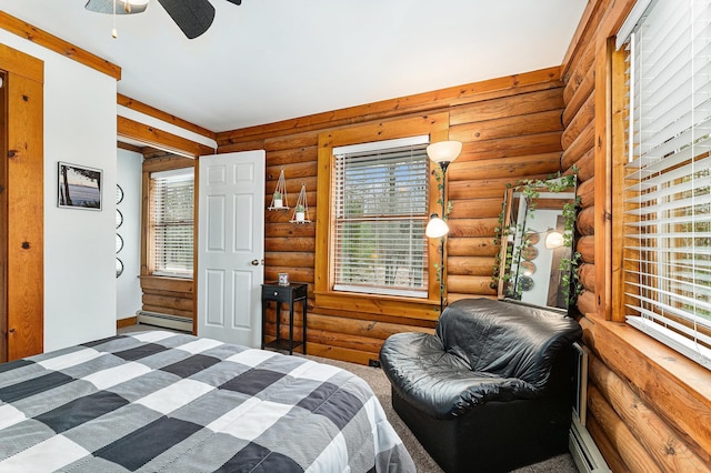 10780 S 29th Rd, Cadillac, MI 49601 - bedroom featuring rustic walls, a baseboard heating unit, and ceiling fan