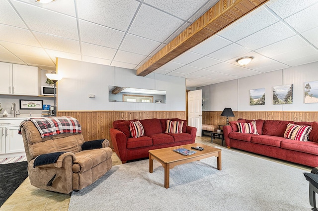 10780 S 29th Rd, Cadillac, MI 49601 - living room with wainscoting, a drop ceiling, wood walls, and carpet flooring