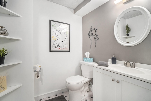 10780 S 29th Rd, Cadillac, MI 49601 - bathroom featuring toilet, vanity, and baseboards