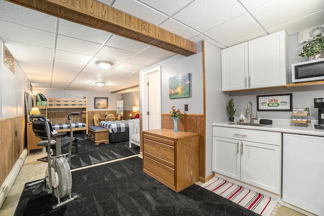 10780 S 29th Rd, Cadillac, MI 49601 - bar with a drop ceiling, a sink, wood walls, and carpet flooring