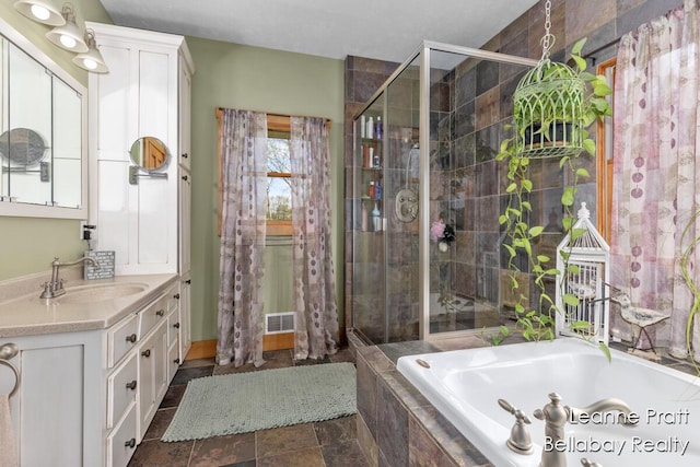 3389 Shultz Rd, Hastings, MI 49058 - bathroom with a bath, a shower stall, and vanity