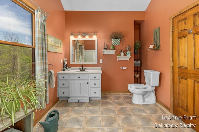 3389 Shultz Rd, Hastings, MI 49058 - full bathroom featuring baseboards, toilet, and vanity