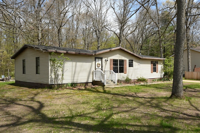 view of front of house with crawl space and a front lawn