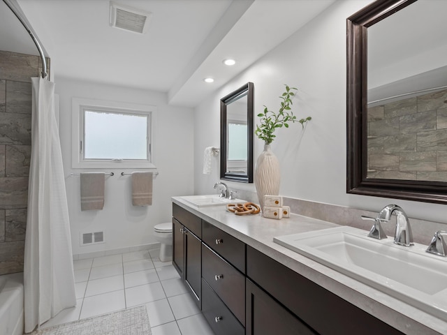 full bath featuring toilet, recessed lighting, double vanity, baseboards, and tile patterned floors