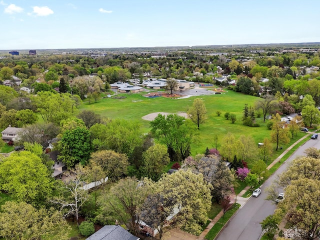 drone / aerial view of a tree filled landscape