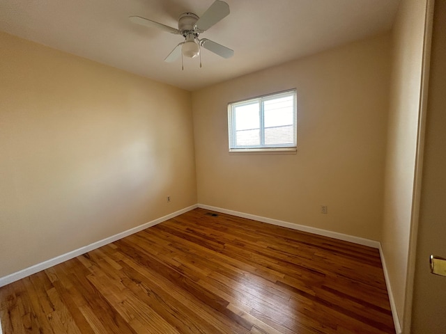 23851 Annapolis St, Dearborn Heights, MI 48125 - unfurnished room featuring baseboards, wood finished floors, and a ceiling fan