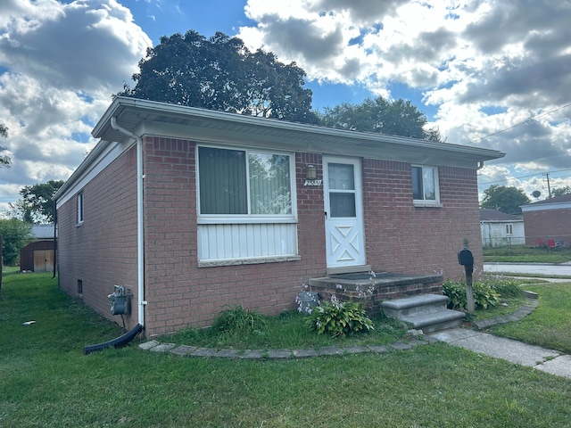 23851 Annapolis St, Dearborn Heights, MI 48125 - bungalow-style home featuring a front lawn and brick siding