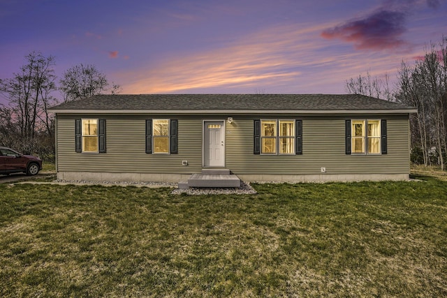 554 Ottawa Trl, Buckley, MI 49620 - ranch-style home with a front lawn and roof with shingles