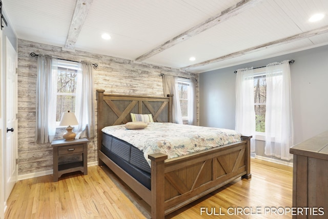 bedroom with baseboards, multiple windows, beam ceiling, light wood-type flooring, and recessed lighting