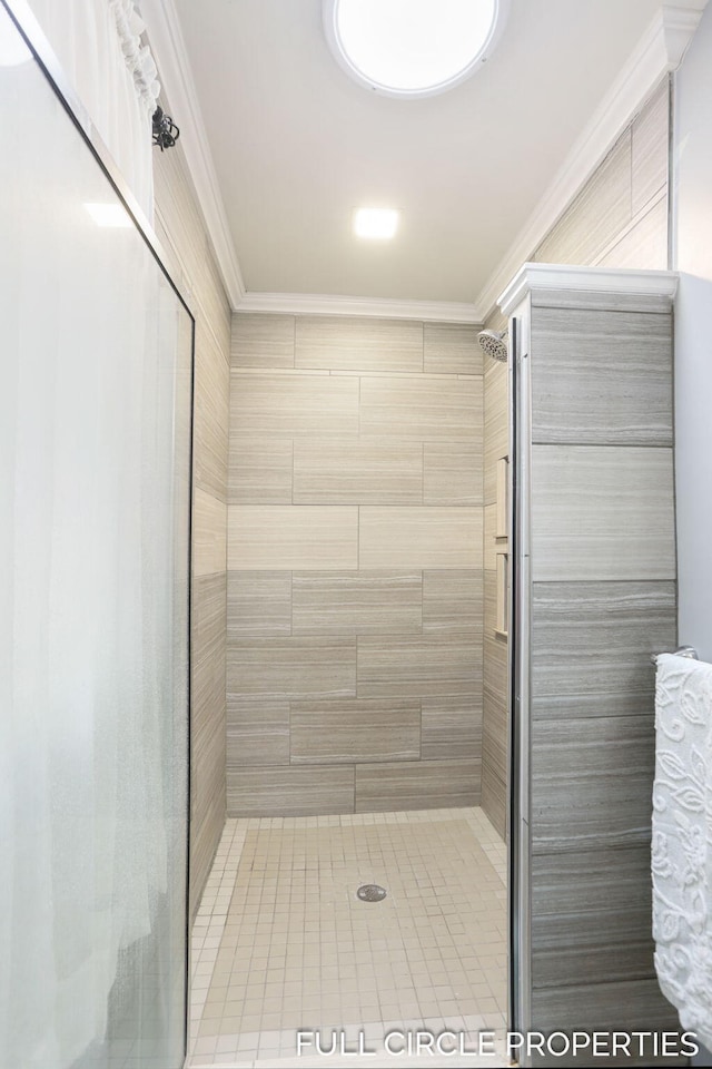 full bath featuring ornamental molding, a stall shower, and tile patterned flooring