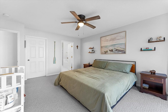 24231 Wilson Dr, Trenton, MI 48183 - bedroom with carpet, baseboards, a ceiling fan, and ensuite bath