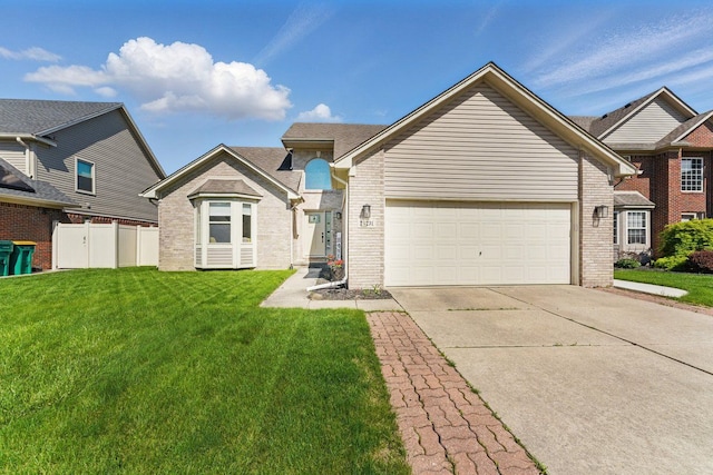 24231 Wilson Dr, Trenton, MI 48183 - view of front facade featuring driveway, brick siding, and an attached garage