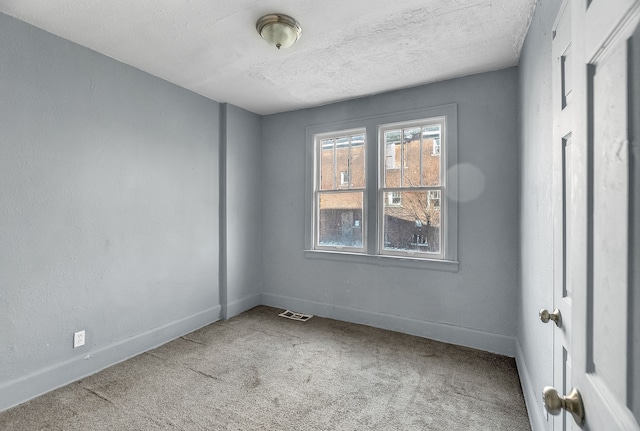 12346 Stoepel St, Detroit, MI 48204 - carpeted spare room featuring baseboards and a textured ceiling