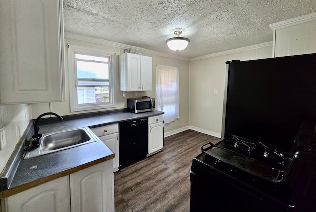 kitchen with black appliances, a sink, dark countertops, dark wood-type flooring, and ornamental molding