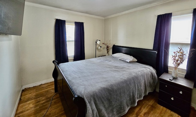 bedroom with dark wood-type flooring, baseboards, crown molding, and multiple windows
