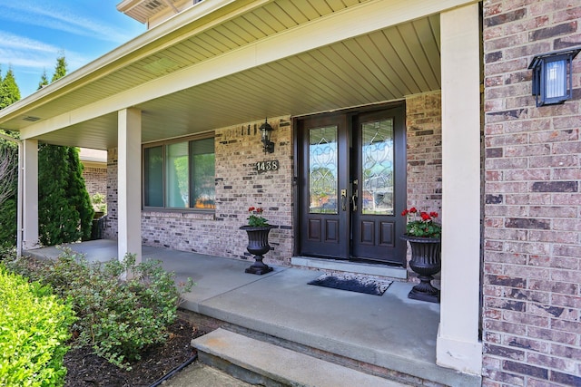 1438 Leafgreen Dr, Troy, MI 48083 - view of exterior entry featuring covered porch and brick siding
