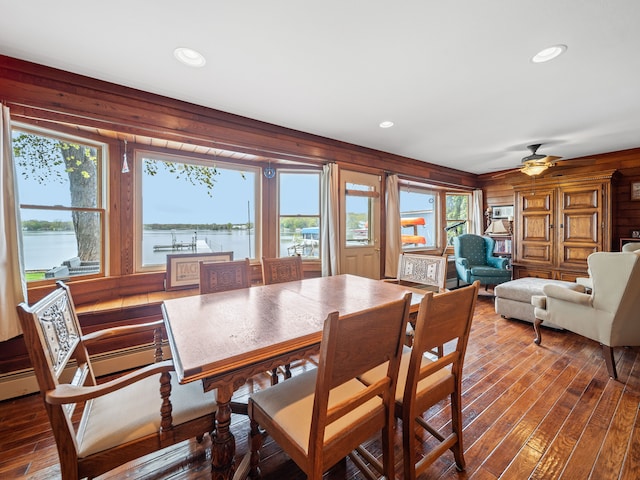 4825 Downing Dr, Pinckney, MI 48169 - dining area featuring wood-type flooring, wooden walls, a water view, ceiling fan, and recessed lighting