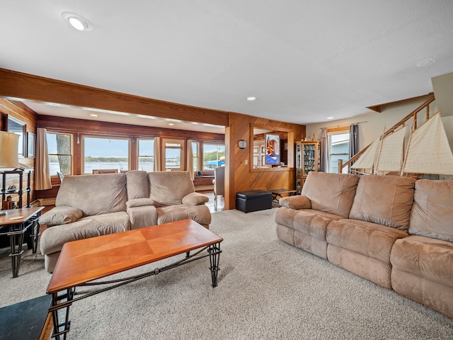 4825 Downing Dr, Pinckney, MI 48169 - carpeted living room featuring plenty of natural light, recessed lighting, and wood walls