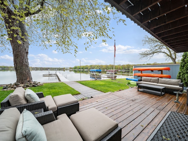 4825 Downing Dr, Pinckney, MI 48169 - deck with a water view, a dock, boat lift, and a yard
