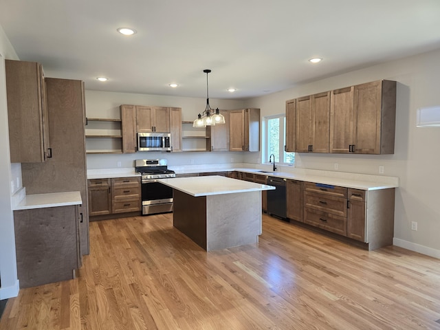 319 Sedgewood Ln, Ann Arbor, MI 48103 - kitchen featuring open shelves, appliances with stainless steel finishes, a sink, light countertops, and light wood-style floors