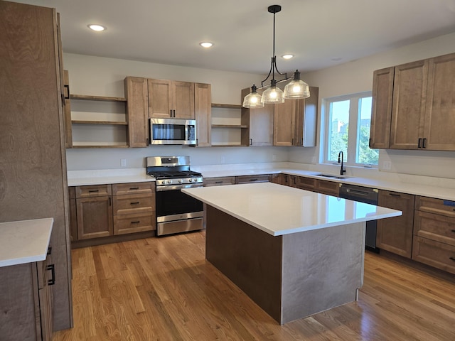 319 Sedgewood Ln, Ann Arbor, MI 48103 - kitchen with stainless steel appliances, open shelves, a sink, wood finished floors, and light countertops