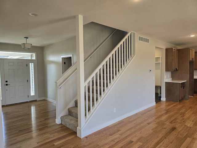 319 Sedgewood Ln, Ann Arbor, MI 48103 - entryway with stairs, wood finished floors, baseboards, and recessed lighting