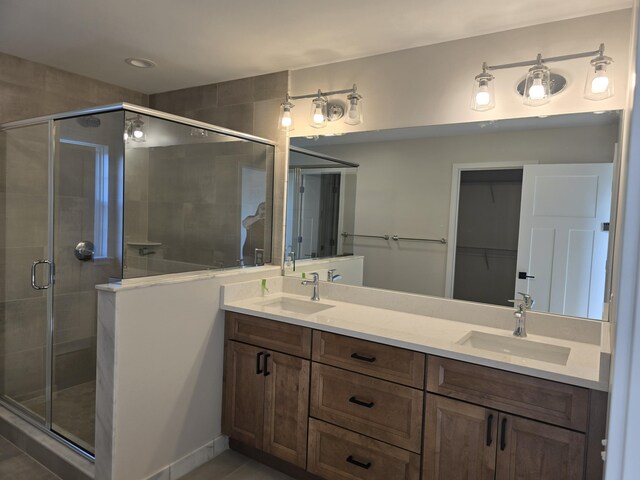 319 Sedgewood Ln, Ann Arbor, MI 48103 - bathroom featuring a stall shower, double vanity, and recessed lighting
