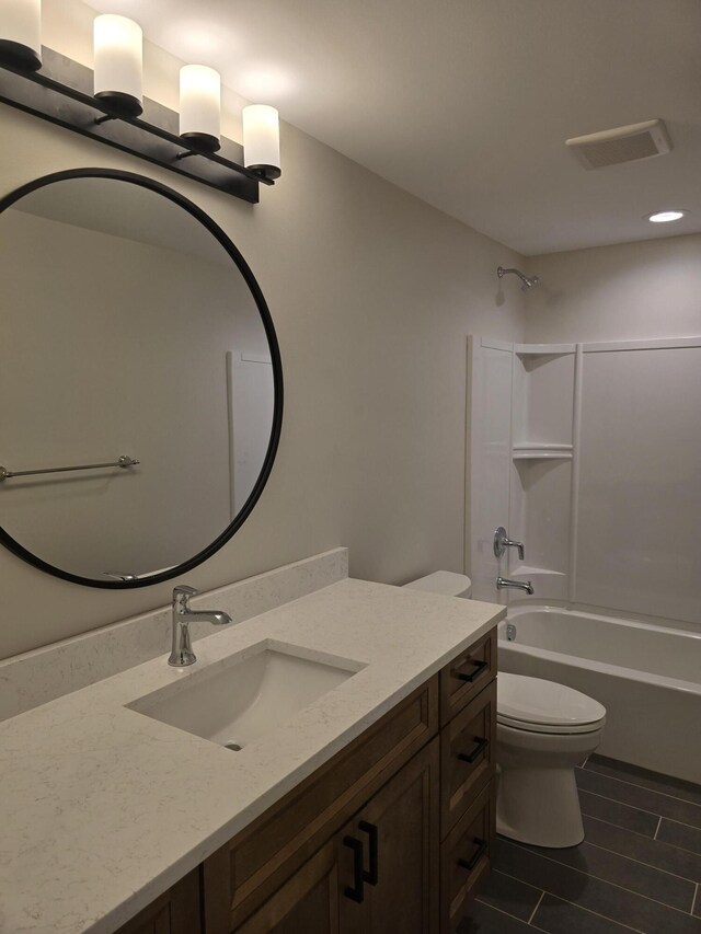 319 Sedgewood Ln, Ann Arbor, MI 48103 - bathroom featuring toilet, vanity, and shower / washtub combination