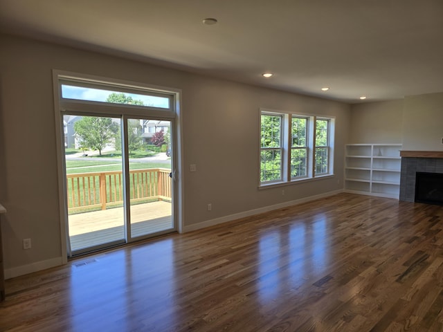 319 Sedgewood Ln, Ann Arbor, MI 48103 - unfurnished living room with a fireplace, wood finished floors, and recessed lighting