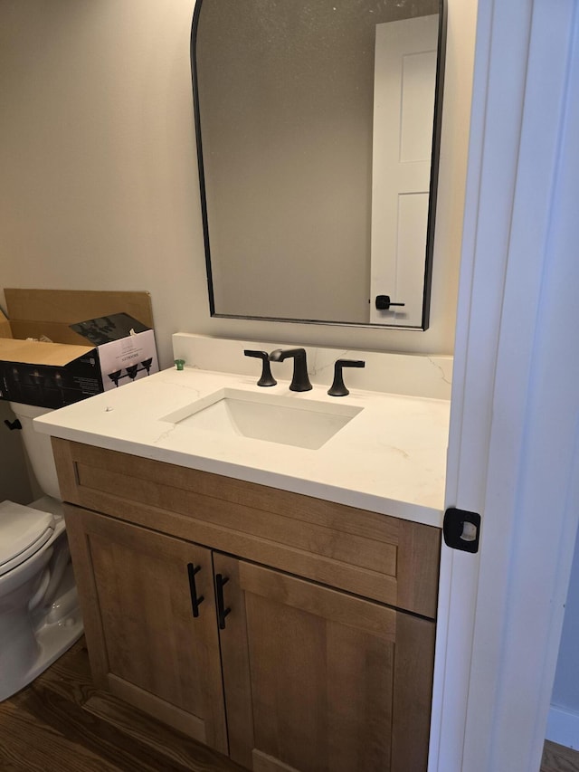 319 Sedgewood Ln, Ann Arbor, MI 48103 - bathroom with vanity and wood finished floors