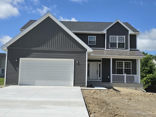 319 Sedgewood Ln, Ann Arbor, MI 48103 - view of front facade featuring covered porch, board and batten siding, concrete driveway, and an attached garage