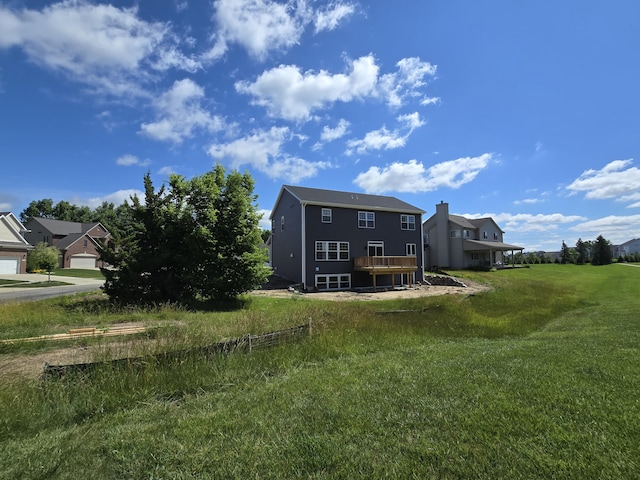319 Sedgewood Ln, Ann Arbor, MI 48103 - back of property featuring a yard and a wooden deck