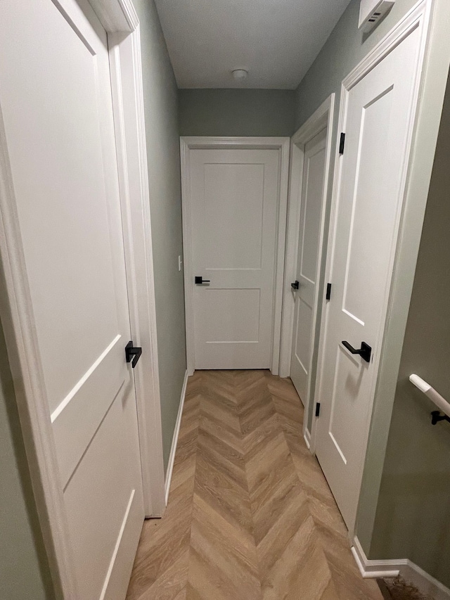 corridor featuring baseboards