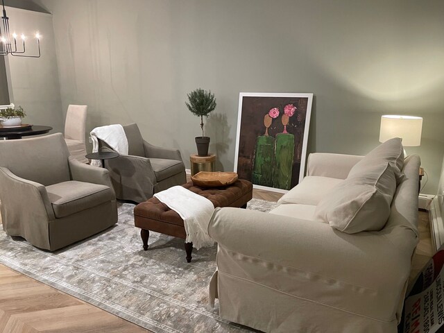 sitting room featuring a chandelier