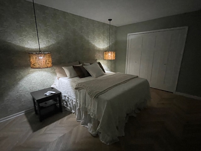 bedroom with a closet and baseboards