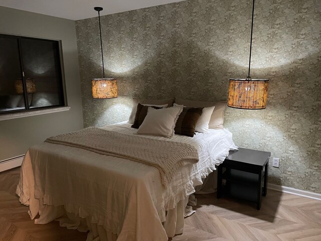 bedroom featuring baseboards and a baseboard radiator