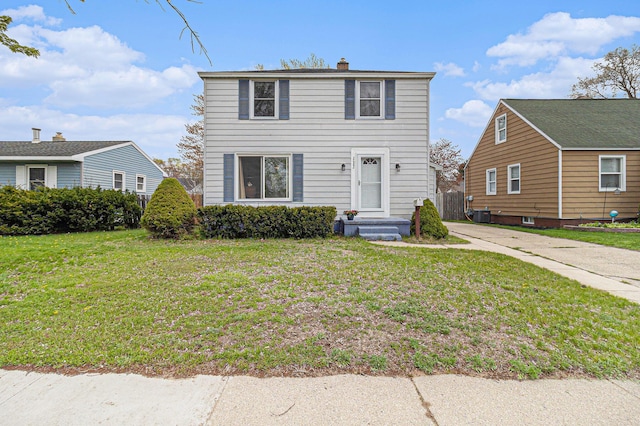 2682 Pinehurst Rd, Norton Shores, MI 49441 - traditional-style house with a chimney and a front lawn