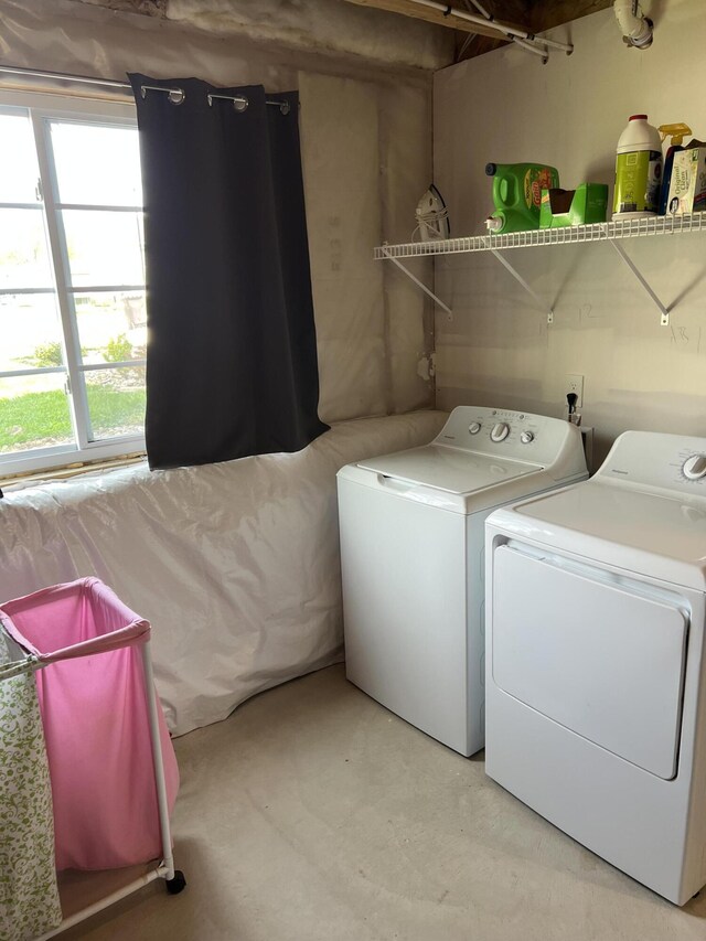 washroom with independent washer and dryer and plenty of natural light