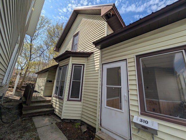 view of side of home featuring a wooden deck