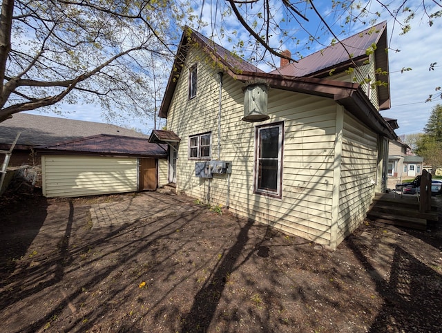 view of home's exterior with driveway and an attached garage