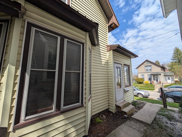 view of side of property with entry steps