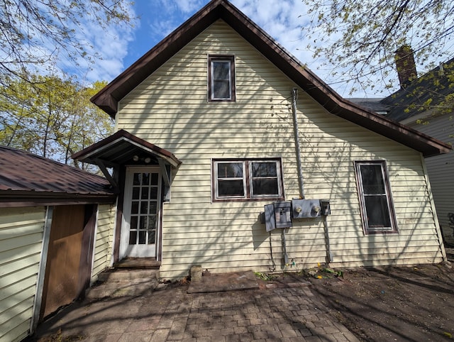 back of house with entry steps