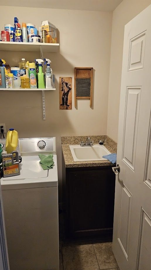 26123 Joanne Smith Ln, Chesterfield, MI 48051 - bathroom with washer / clothes dryer, vanity, and tile patterned floors