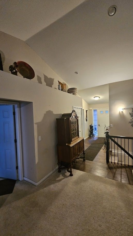 26123 Joanne Smith Ln, Chesterfield, MI 48051 - interior space with lofted ceiling, baseboards, and carpet
