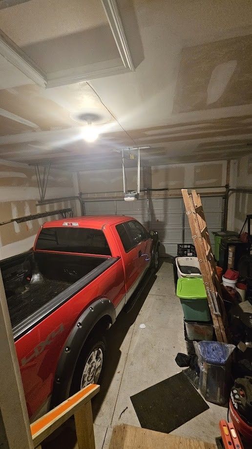 26123 Joanne Smith Ln, Chesterfield, MI 48051 - garage with a garage door opener